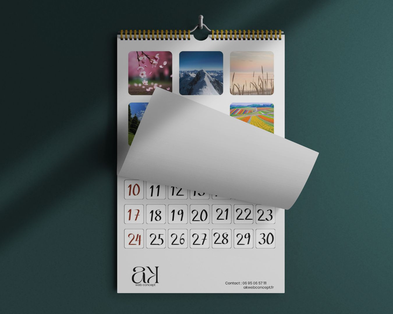 Calendrier mural vertical avec des photos de paysages, montrant une page qui se soulève pour dévoiler les dates, créé par AK Web Concept.