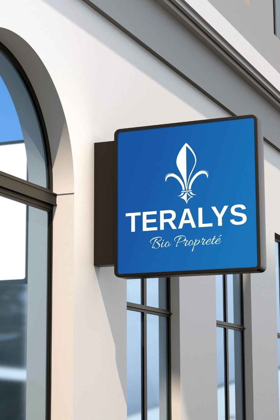 Enseigne lumineuse carrée bleue de Teralys Bio Propreté, fixée sur la façade d'un bâtiment moderne à l'architecture épurée.